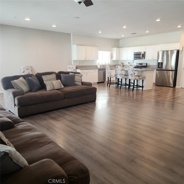 4979 Graphite Creek Rd, Jurupa Valley, CA 91752 - living area featuring wood finished floors and recessed lighting