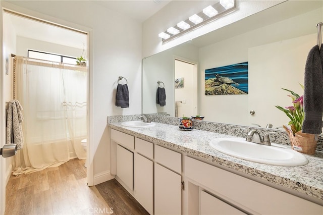 2619 Amanecida, Chico, CA 95928 - bathroom featuring wood finished floors, double vanity, and shower / bath combination with curtain