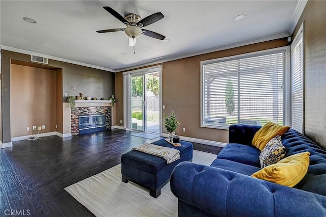 609 Raphael Dr, Corona, CA 92882 - living room with ornamental molding, a stone fireplace, ceiling fan, and wood finished floors