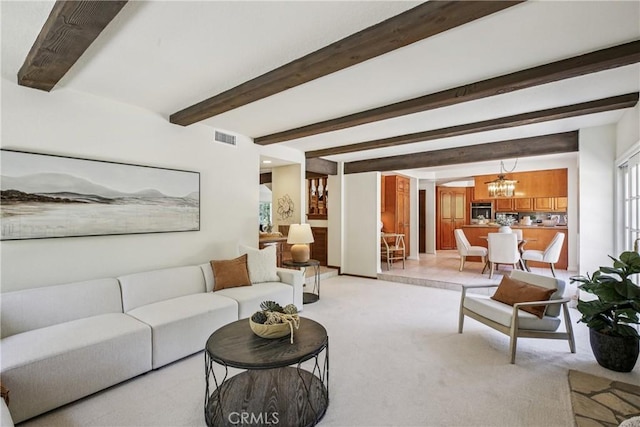 24615 Kings Rd, Laguna Niguel, CA 92677 - living area with a chandelier, light carpet, and beam ceiling