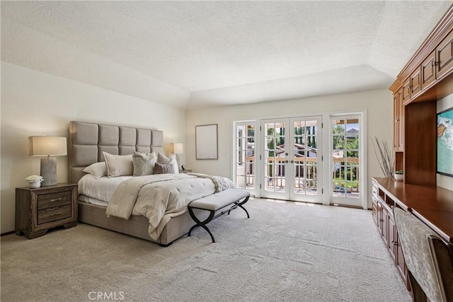 24615 Kings Rd, Laguna Niguel, CA 92677 - bedroom with access to exterior, light carpet, a textured ceiling, french doors, and vaulted ceiling