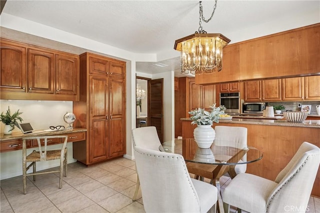 24615 Kings Rd, Laguna Niguel, CA 92677 - dining space with a chandelier, light tile patterned flooring, and a desk