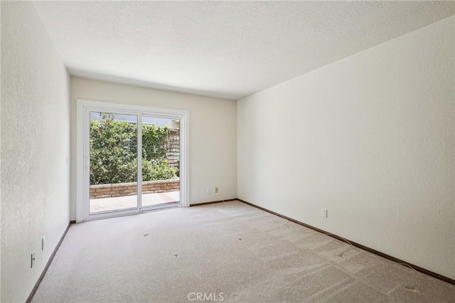 24615 Kings Rd, Laguna Niguel, CA 92677 - carpeted spare room featuring a textured wall and a textured ceiling