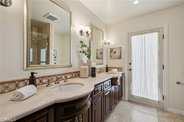 24615 Kings Rd, Laguna Niguel, CA 92677 - bathroom with double vanity, tile patterned flooring, and a shower