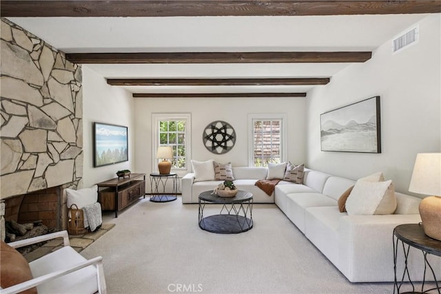 24615 Kings Rd, Laguna Niguel, CA 92677 - living area featuring carpet, beam ceiling, and a stone fireplace