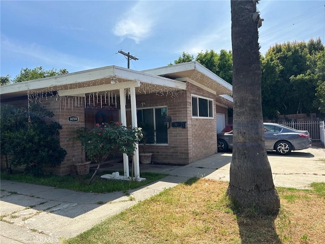 14914 Sylvan St, Van Nuys, CA 91411 - view of property exterior featuring brick siding