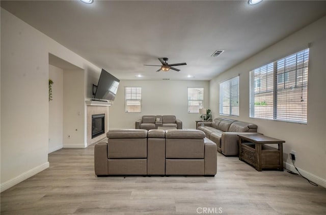 15930 Chorus Ln, Fontana, CA 92336 - living room featuring recessed lighting, ceiling fan, light wood-style floors, and a tile fireplace