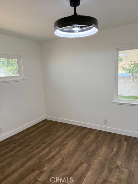 14516 Florita Rd, La Mirada, CA 90638 - unfurnished room featuring dark wood-style floors and plenty of natural light