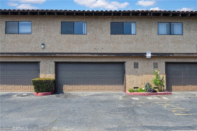 4072 Rosemead Blvd Unit 7, Pico Rivera, CA 90660 - rear view of house featuring stucco siding and an attached garage