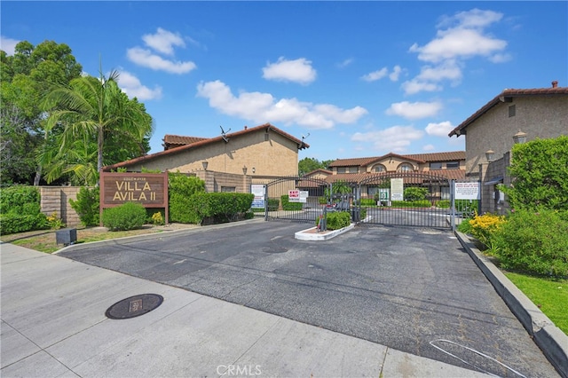 4072 Rosemead Blvd Unit 7, Pico Rivera, CA 90660 - view of asphalt road featuring a gate, a gated entry, and curbs