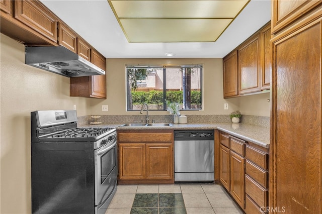4072 Rosemead Blvd Unit 7, Pico Rivera, CA 90660 - kitchen with stainless steel appliances, ventilation hood, brown cabinets, and light tile patterned flooring