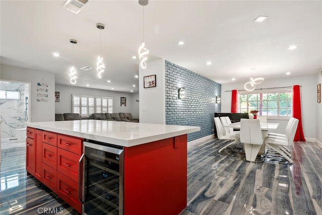 10225 Donna Ave, Northridge, CA 91324 - kitchen with beverage cooler, open floor plan, recessed lighting, a center island, and dark wood-style floors