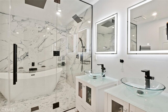 10225 Donna Ave, Northridge, CA 91324 - full bath with a marble finish shower, a soaking tub, and two vanities