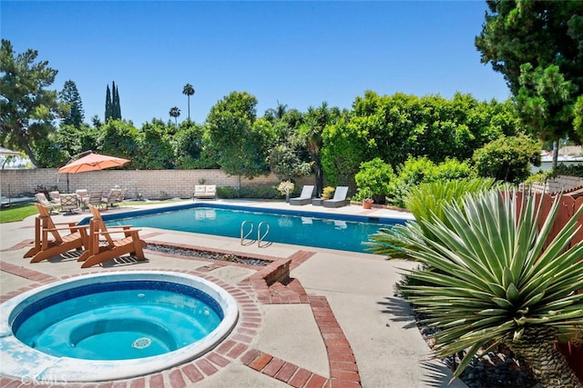 10225 Donna Ave, Northridge, CA 91324 - view of swimming pool featuring an in-ground hot tub, a patio, and a fenced backyard