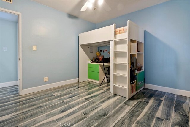 10225 Donna Ave, Northridge, CA 91324 - unfurnished bedroom with wood finished floors and baseboards