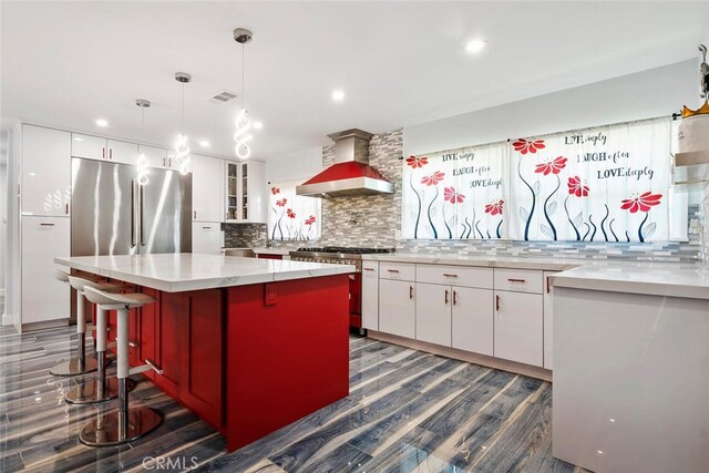 10225 Donna Ave, Northridge, CA 91324 - kitchen featuring ventilation hood, appliances with stainless steel finishes, white cabinets, dark wood-type flooring, and recessed lighting