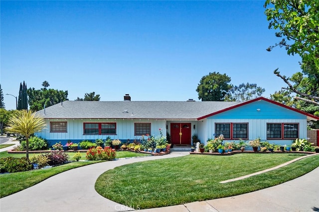 10225 Donna Ave, Northridge, CA 91324 - single story home with board and batten siding, a front yard, roof with shingles, and a chimney