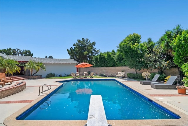10225 Donna Ave, Northridge, CA 91324 - view of pool featuring a patio, a diving board, and a fenced backyard