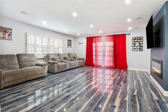 10225 Donna Ave, Northridge, CA 91324 - living room featuring recessed lighting, wood finished floors, and a glass covered fireplace