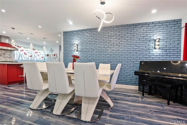 10225 Donna Ave, Northridge, CA 91324 - dining room featuring brick wall, dark wood-type flooring, and recessed lighting