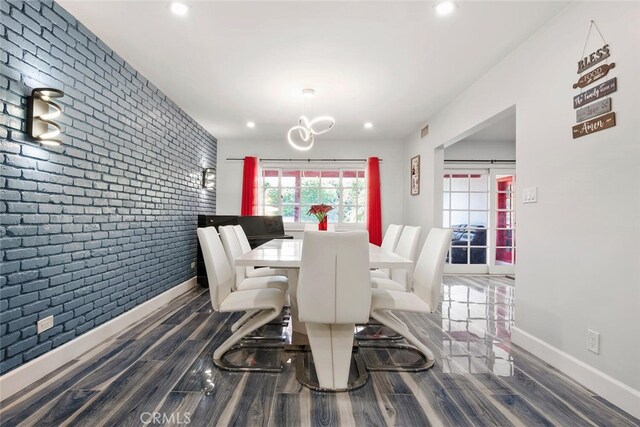 10225 Donna Ave, Northridge, CA 91324 - dining space featuring brick wall, wood finished floors, a chandelier, and recessed lighting