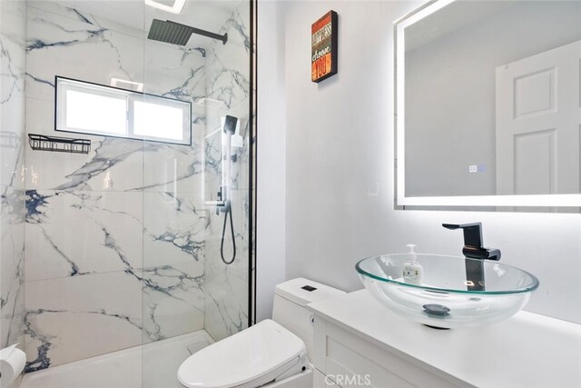 10225 Donna Ave, Northridge, CA 91324 - bathroom with vanity and a marble finish shower