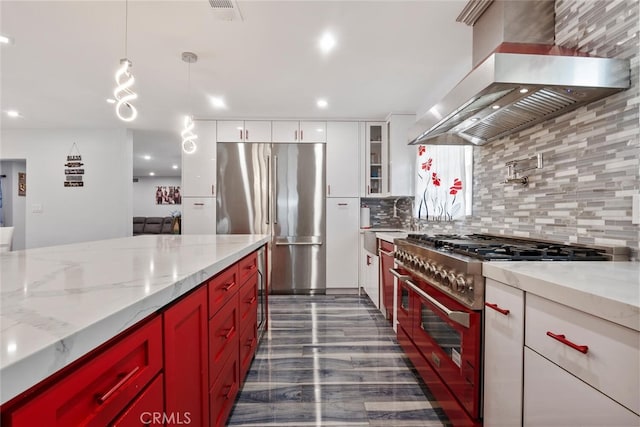 10225 Donna Ave, Northridge, CA 91324 - kitchen with wall chimney range hood, appliances with stainless steel finishes, tasteful backsplash, white cabinets, and light stone countertops
