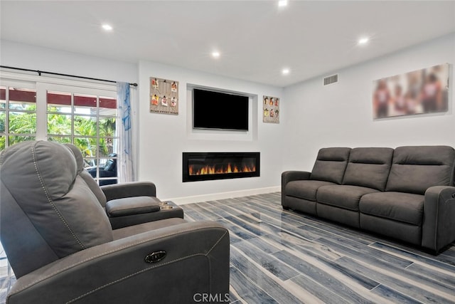 10225 Donna Ave, Northridge, CA 91324 - living area featuring recessed lighting, wood finished floors, and a glass covered fireplace