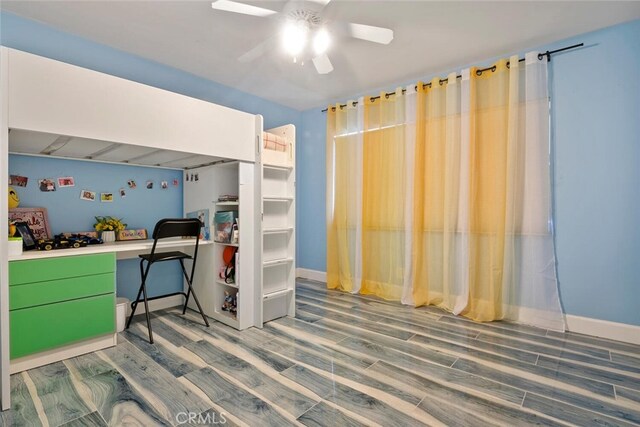 10225 Donna Ave, Northridge, CA 91324 - bedroom with wood finished floors, ceiling fan, and built in study area
