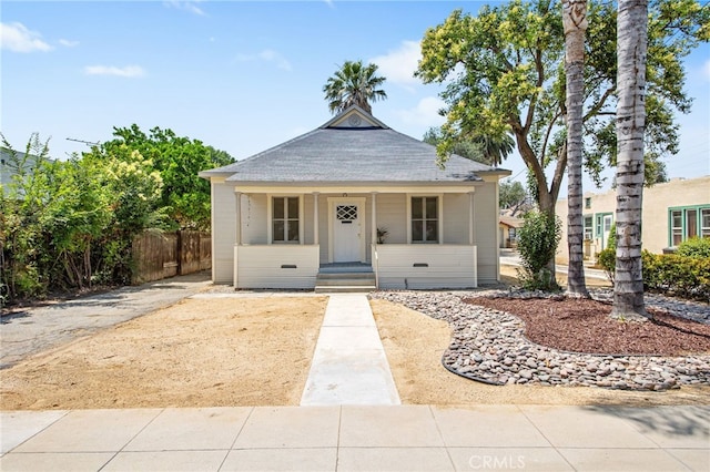 3141 Locust St, Riverside, CA 92501 - bungalow-style house with covered porch and roof with shingles