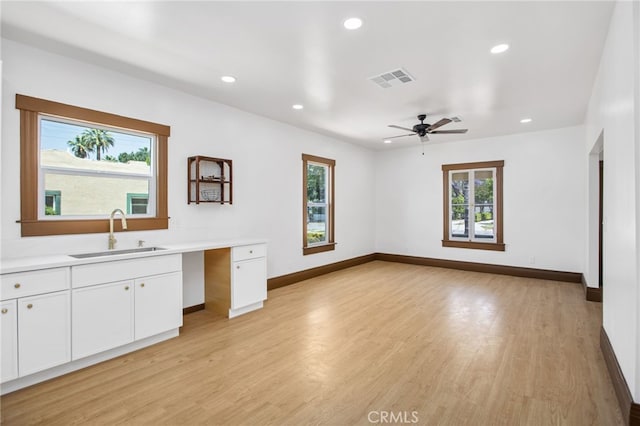 3141 Locust St, Riverside, CA 92501 - unfurnished living room with plenty of natural light, recessed lighting, light wood-style flooring, and ceiling fan
