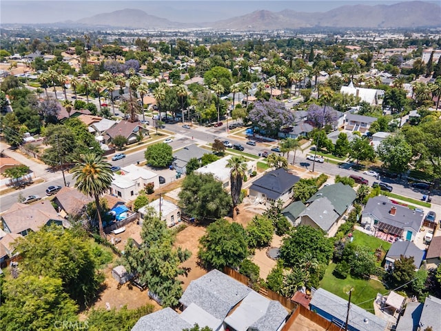 3141 Locust St, Riverside, CA 92501 - aerial overview of property's location with a mountainous background and nearby suburban area