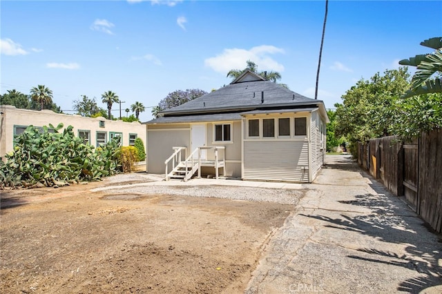 3141 Locust St, Riverside, CA 92501 - rear view of property with roof with shingles