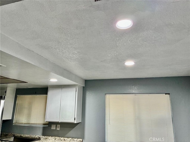 15400 Don Roberto Rd, Victorville, CA 92394 - detailed view of a textured ceiling, white cabinetry, and recessed lighting