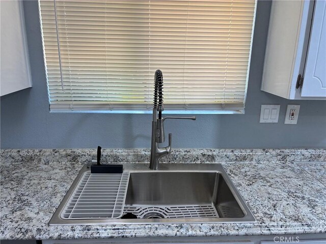 15400 Don Roberto Rd, Victorville, CA 92394 - kitchen view of white cabinetry and light stone countertops
