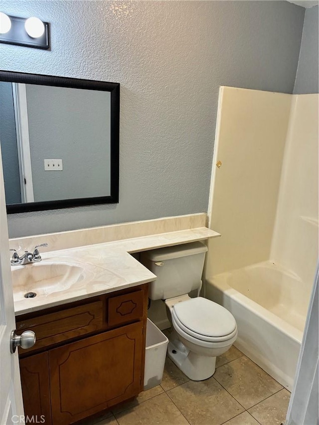 15400 Don Roberto Rd, Victorville, CA 92394 - full bathroom with vanity, tile patterned floors, a textured wall, and bathtub / shower combination