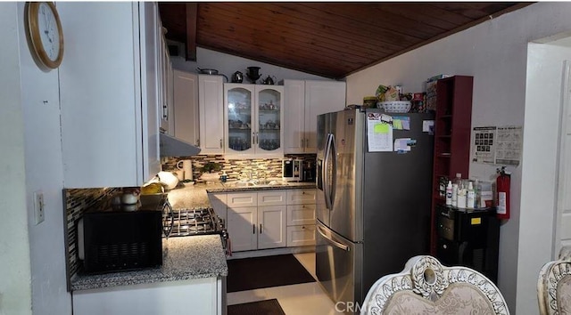735 E Hanks St, Azusa, CA 91702 - kitchen with freestanding refrigerator, wood ceiling, vaulted ceiling, tasteful backsplash, and white cabinetry