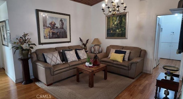 735 E Hanks St, Azusa, CA 91702 - living area with light wood-style floors and a chandelier