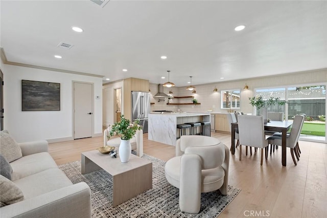 11861 Amethyst St, Garden Grove, CA 92845 - living room featuring light wood-style flooring, recessed lighting, and crown molding