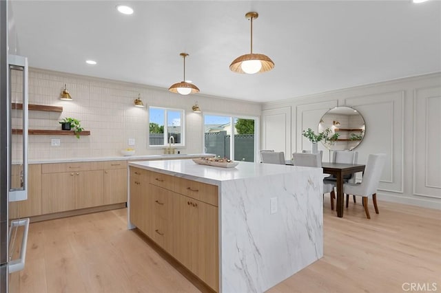 11861 Amethyst St, Garden Grove, CA 92845 - kitchen featuring light brown cabinets, open shelves, a kitchen island, and light wood finished floors