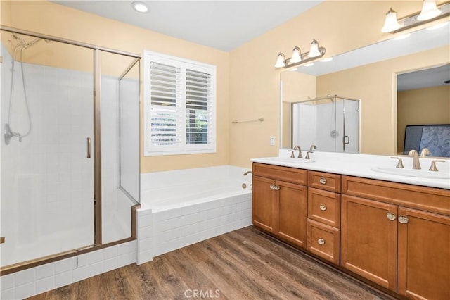 26865 Shelter Cove Ct, Menifee, CA 92585 - full bath with a stall shower, double vanity, wood finished floors, and a garden tub
