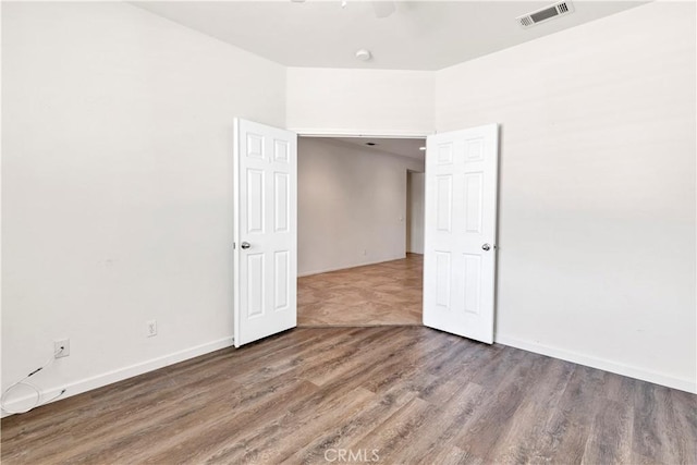26865 Shelter Cove Ct, Menifee, CA 92585 - spare room featuring wood finished floors and baseboards