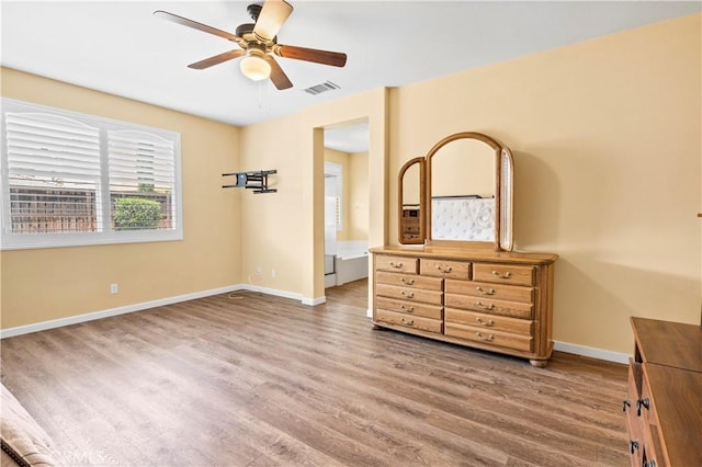 26865 Shelter Cove Ct, Menifee, CA 92585 - unfurnished bedroom with wood finished floors and a ceiling fan