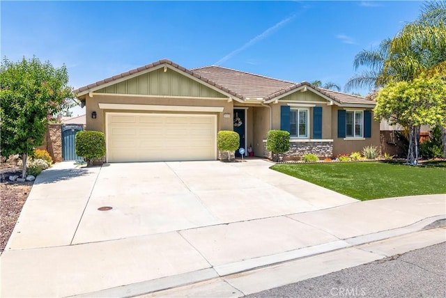 26865 Shelter Cove Ct, Menifee, CA 92585 - ranch-style house featuring a tiled roof, an attached garage, a front yard, driveway, and stucco siding
