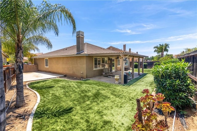 26865 Shelter Cove Ct, Menifee, CA 92585 - back of property with a patio area, a fenced backyard, a ceiling fan, and stucco siding