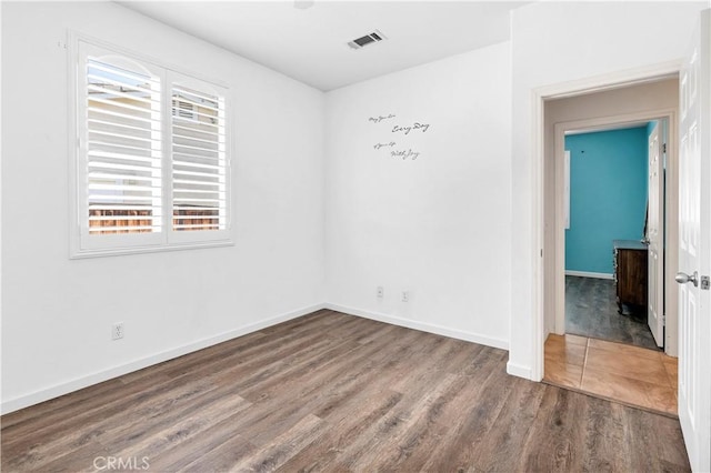 26865 Shelter Cove Ct, Menifee, CA 92585 - empty room featuring wood finished floors and baseboards