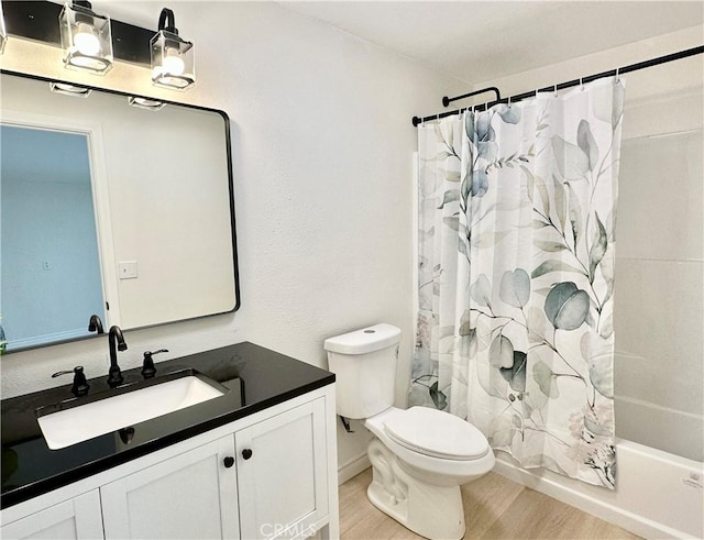 1439 Sheridan Rd, San Bernardino, CA 92407 - bathroom featuring wood finished floors, vanity, and shower / bath combo