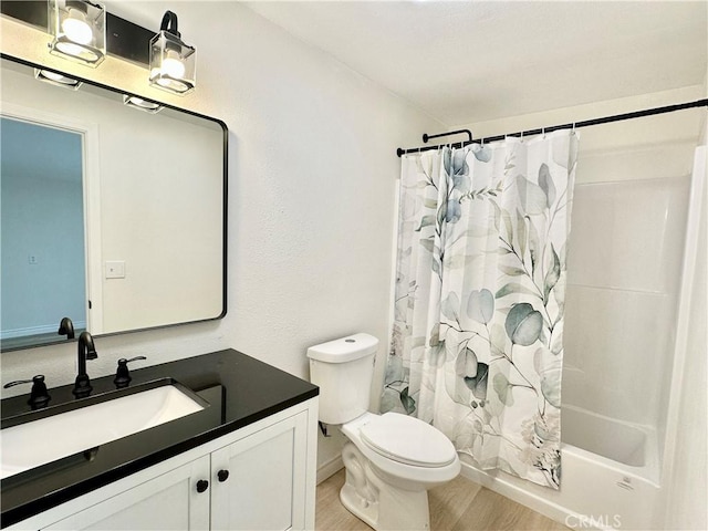 1439 Sheridan Rd, San Bernardino, CA 92407 - bathroom with vanity, wood finished floors, and shower / tub combo with curtain
