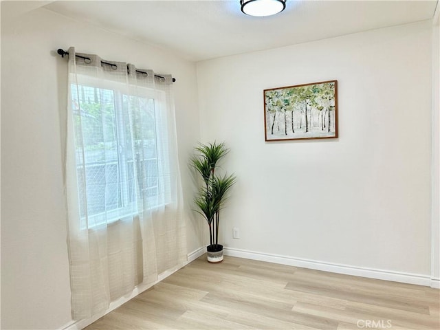 1439 Sheridan Rd, San Bernardino, CA 92407 - unfurnished room with light wood-style floors and baseboards