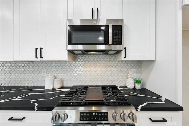 6304 Pablo Ct, Chino, CA 91710 - kitchen featuring stainless steel appliances, white cabinetry, dark countertops, and decorative backsplash